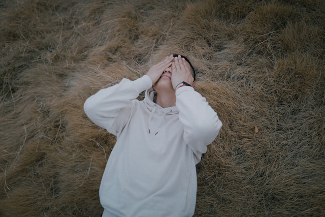 a lady covering eyes