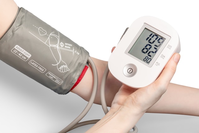 picture of hand and reading blood pressure