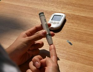a diabetics patient testing blood sugar level