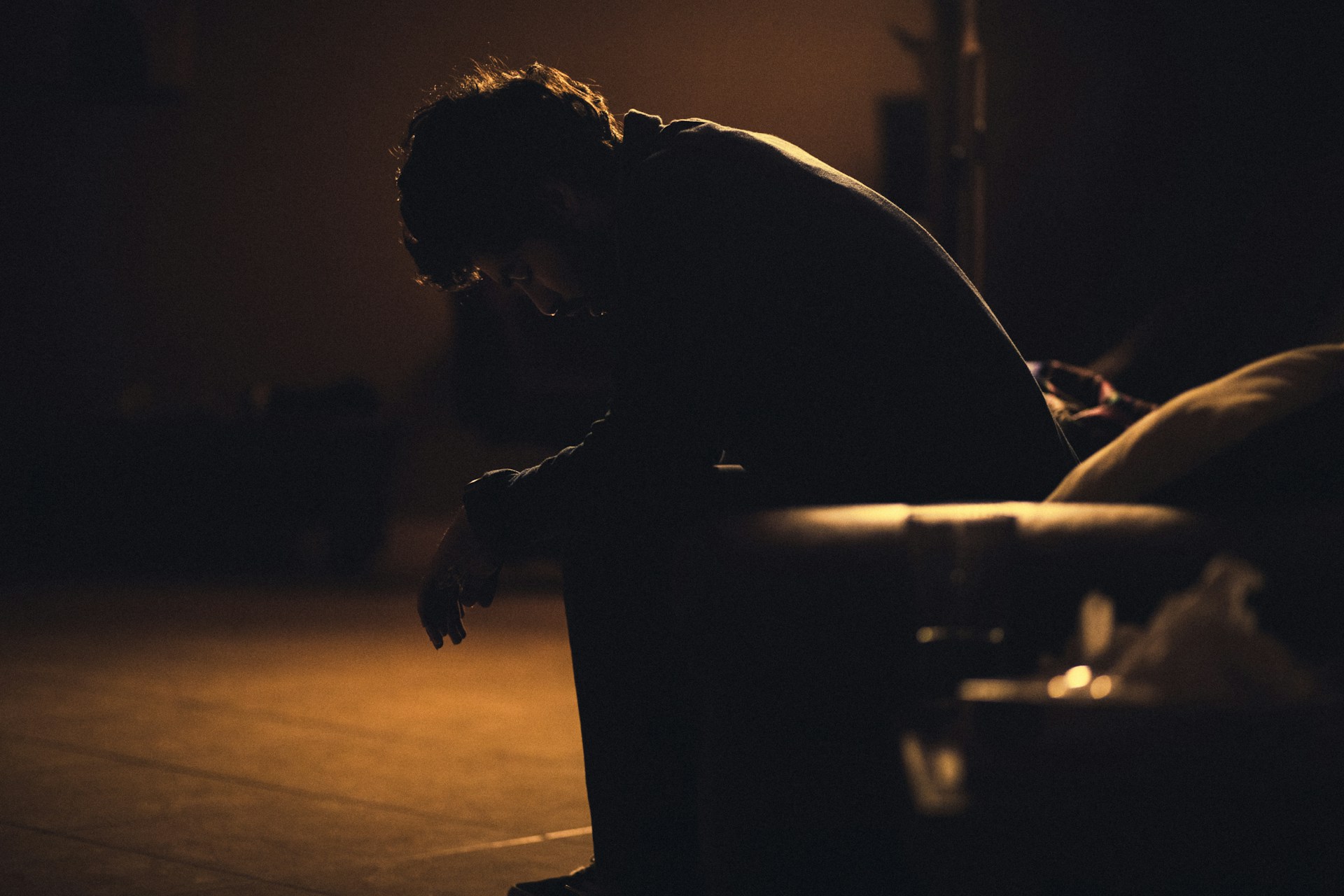 a sad guy looking down
