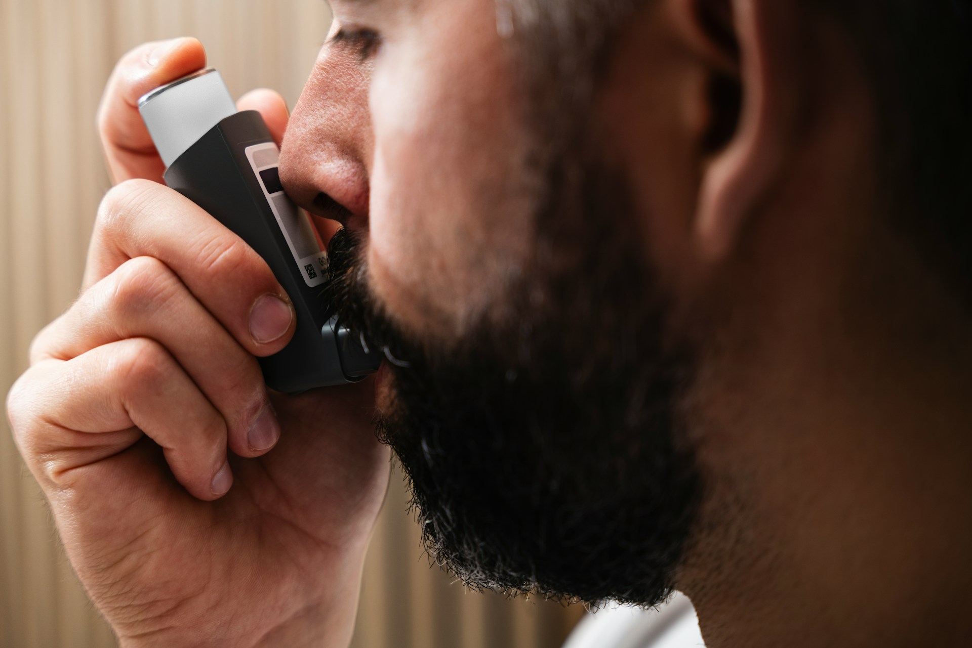 a man taming his lung disease with inhaler